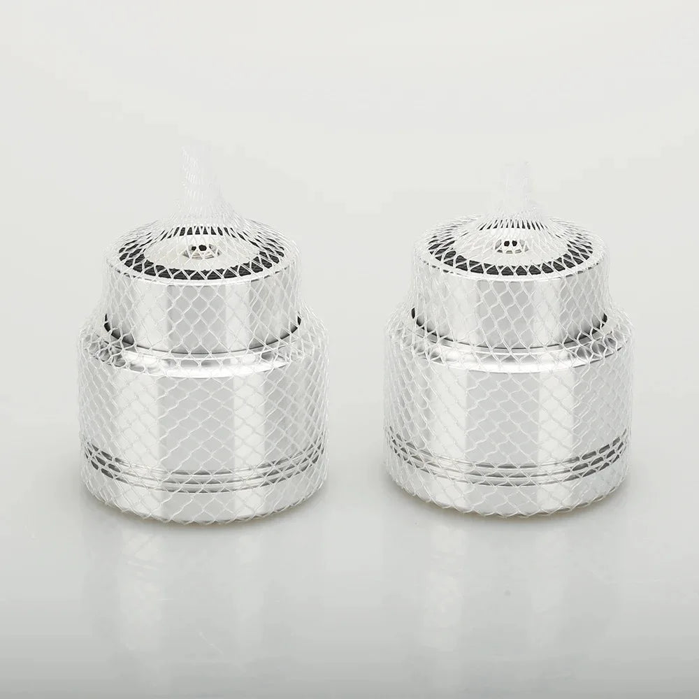 Two identical silver aluminum alloy maglev float speaker stand spikes with mesh design and perforated tops for turntable cd player and computer dac