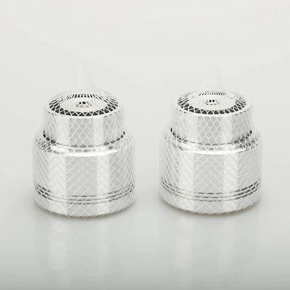 Two identical silver aluminum alloy maglev float speaker stand spikes with mesh design and perforated tops for turntable cd player and computer dac
