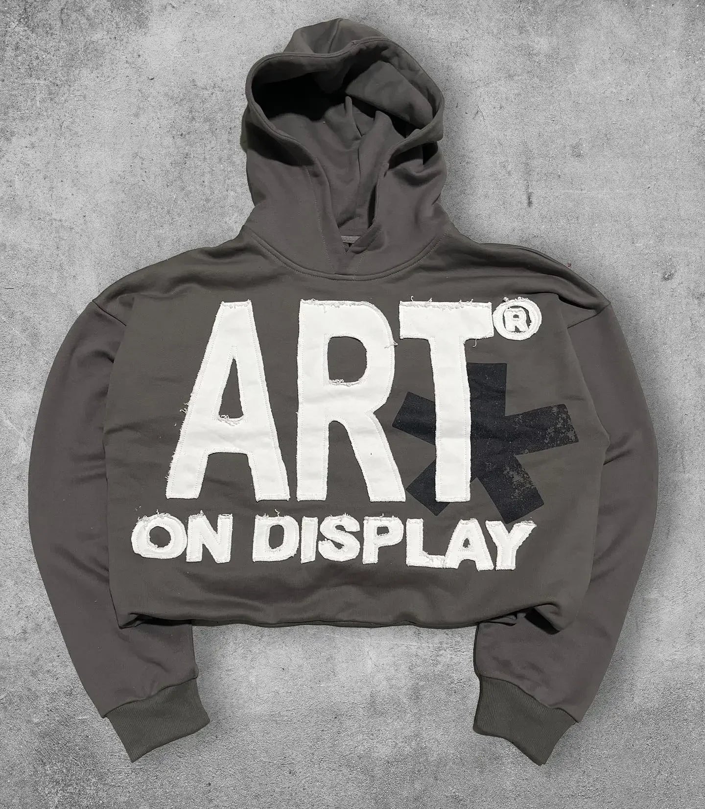 Dark gray cropped hoodie men y2k with bold white art on display lettering and black cross graphic for gothic couple casual wear