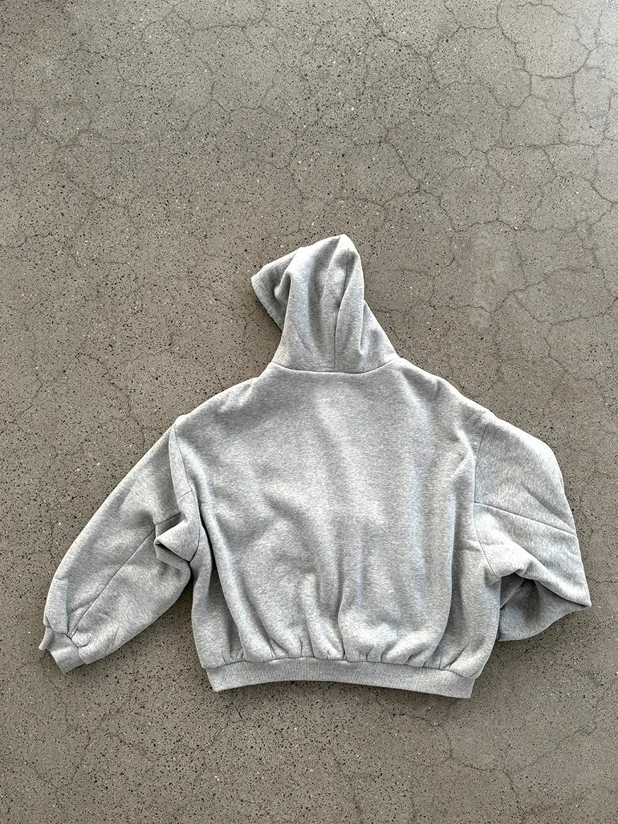 A soft heather gray cropped hoodie men y2k with a relaxed fit and elastic cuffs for casual joker sweatshirt style
