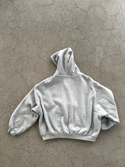 A soft heather gray cropped hoodie men y2k with a relaxed fit and elastic cuffs for casual joker sweatshirt style