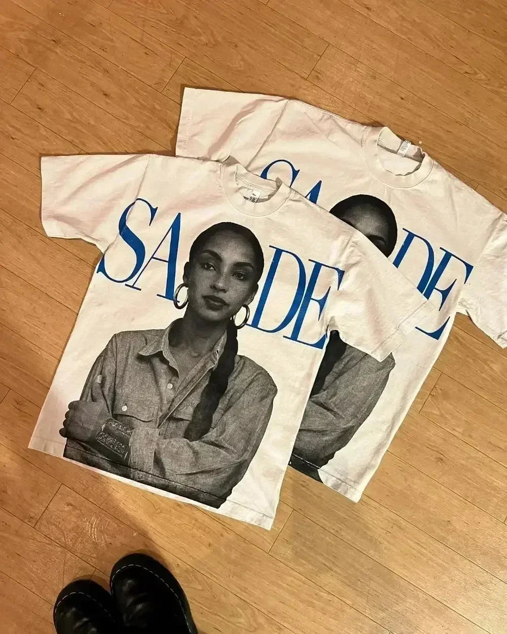 White cotton oversized couples goth t shirt with black and white sade portrait and bold blue lettering american harajuku high basketball tops y2k