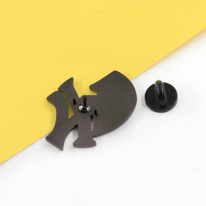 Black enamel brooch featuring the iconic Yankees baseball team logo as a music brand lapel pin accessory for fans