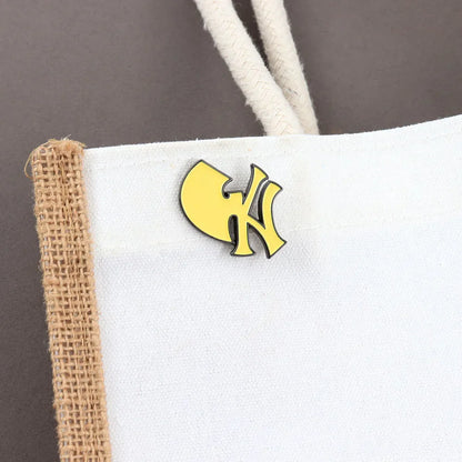 Yellow wu-tang clan logo enamel brooch east with black outline metal baseball team logo music brand lapel pin badge