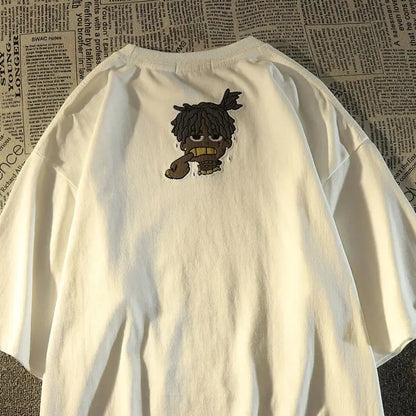 White oversized American hip hop fashion brand t-shirt showing back side with cartoon dreadlocks and gold teeth embroidery