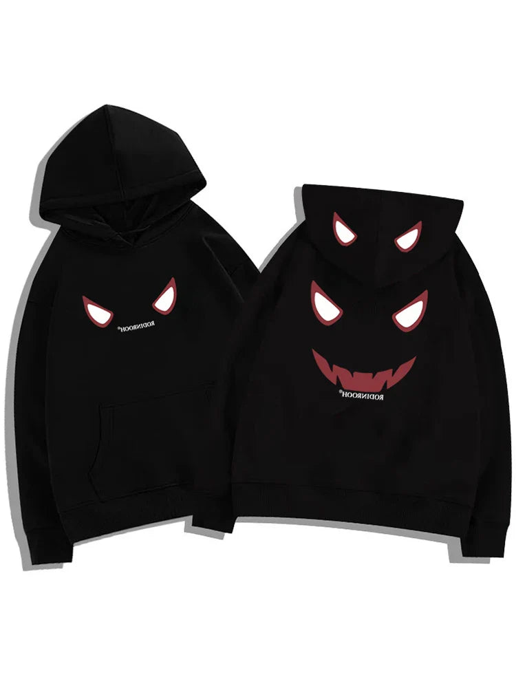 Black fleece y2k streetwear hoodie featuring a devil graphic with glowing red eyes and jagged teeth for american hip hop style