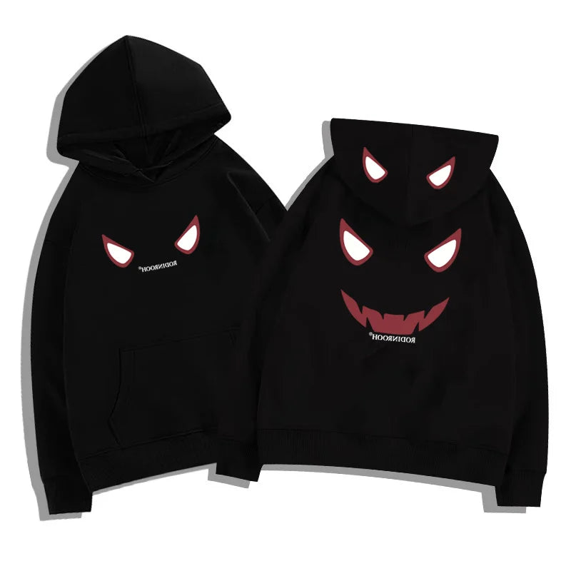 Black fleece y2k streetwear hoodie featuring a devil graphic with glowing eyes and wide grin in american hip hop style