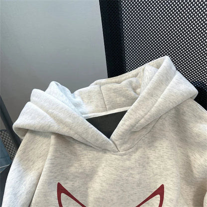 A soft heathered gray fleece y2k streetwear hoodie with cozy hood and red devil graphic for american hip hop style