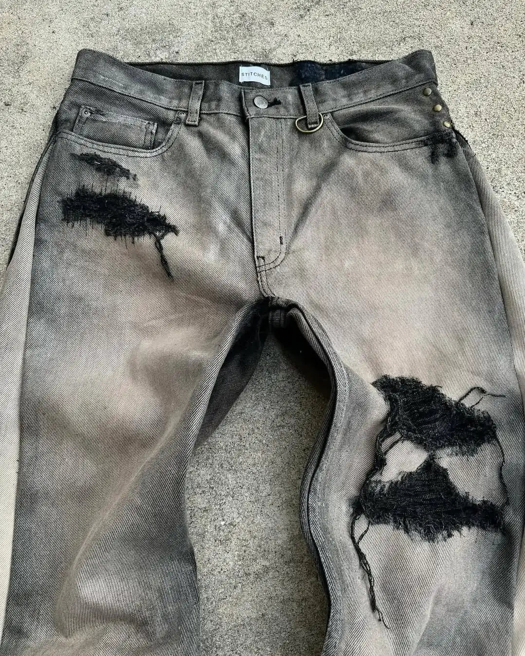 Distressed gray denim american hip hop mens jeans with waist frayed patchwork embroidery micro flared design