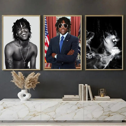Three framed black and white and color lil yachty portraits above marble table in rapper chief keef music retro poster decor