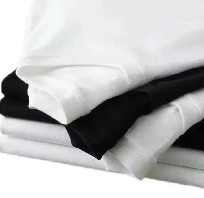 Stack of neatly folded white and black pure cotton loose t-shirts with american hip hop printed versatile short sleeves