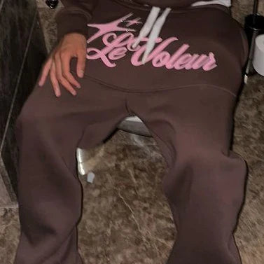 Brown sweatpants with pink le voleur lettering and white drawstrings from american letter graphics piece set y2k womens sportswear hip