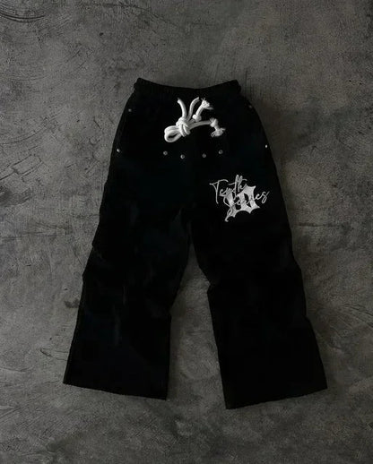 Black corduroy pants baggy sweatpants with white american letter patch logo and silver studs on elastic waistband layer design y2k