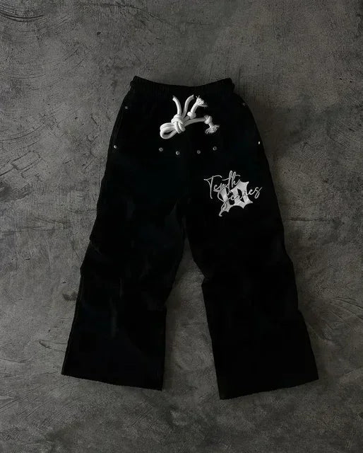 Black corduroy pants baggy sweatpants with white american letter patch logo and silver studs on elastic waistband layer design y2k