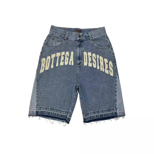 Blue faded wash denim shorts with frayed hem and cream letter embroidery in american style harajuku retro design