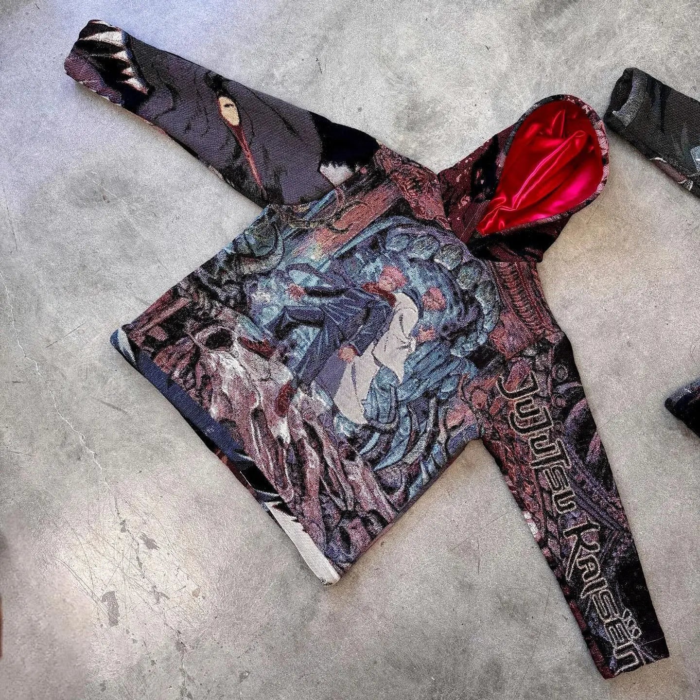A dark oversized style hoodie y2k with vibrant anime print and red satin-lined hood for y2k clothes mens and womens
