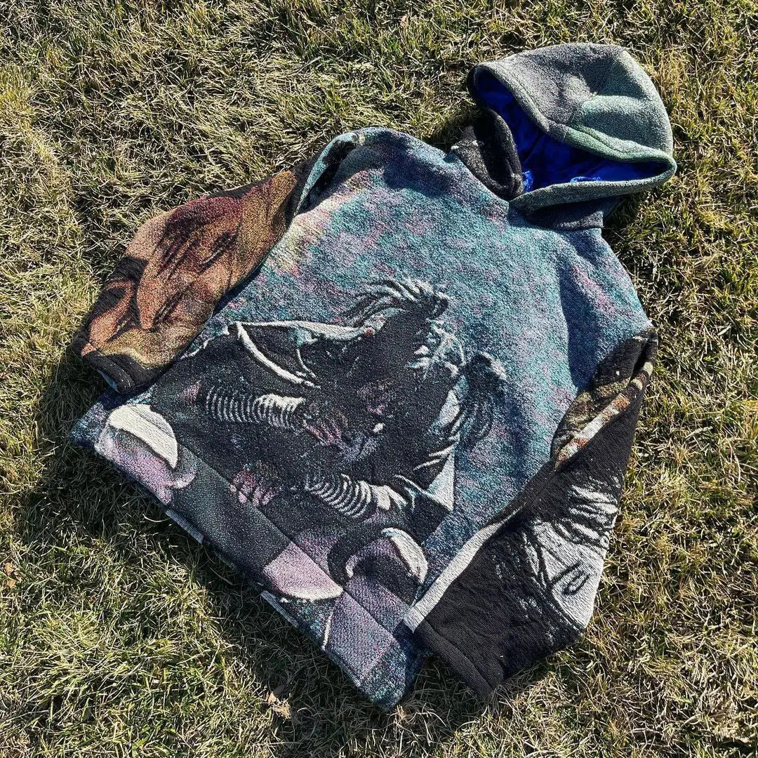 A textured multicolored oversized hoodie y2k clothes mens featuring a 3d graphic print of an astronaut with earth scenery
