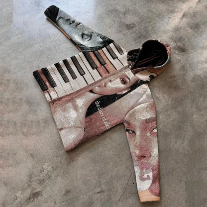 A y2k style hoodie featuring a surreal collage of faces and piano keys in muted tones with the diary of alia text