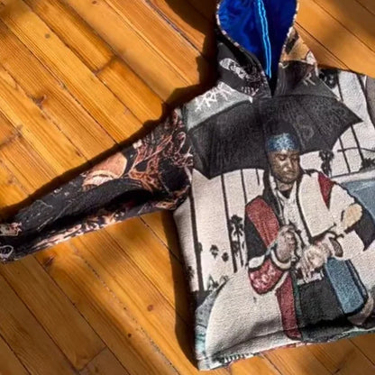 Black and white tapestry style hoodie y2k with blue-lined hood featuring 3d graphic of man holding umbrella for y2k clothes mens