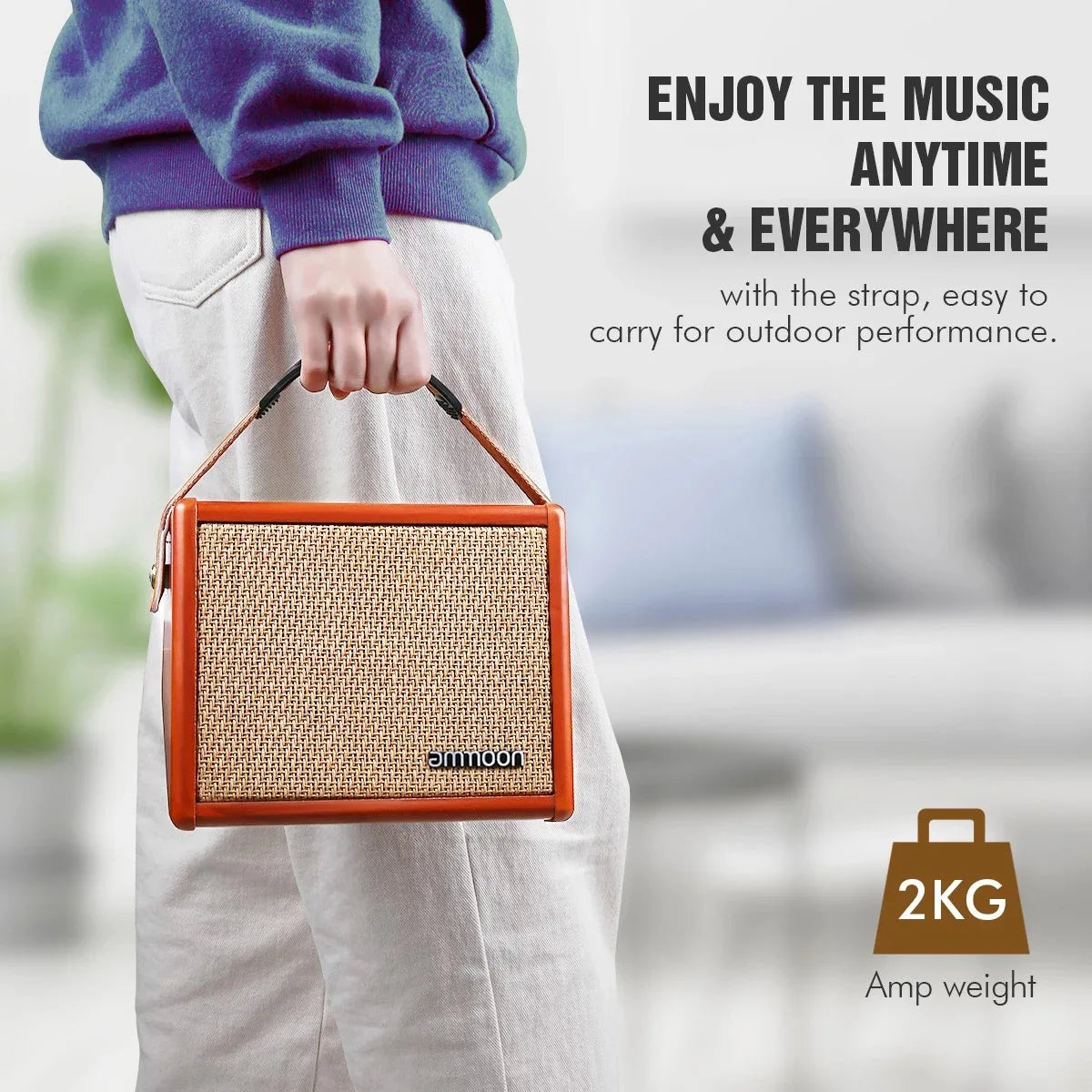 Orange-framed ammoon acoustic guitar amplifier with woven beige grille and black handle strap featuring reverb effect