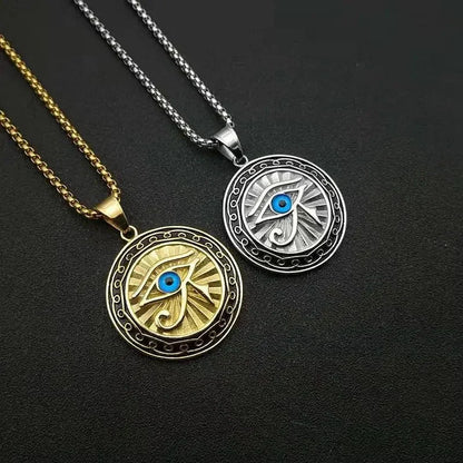 Two circular ancient egyptian mythology horus pendant necklaces in gold and silver tones with blue center stones