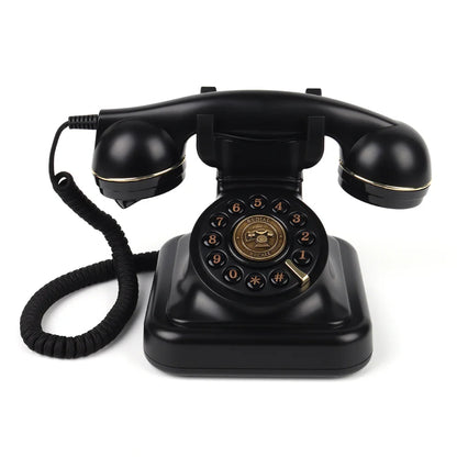 Black vintage rotary telephone with gold accents and coiled cord used as an antique wedding audio guest book device