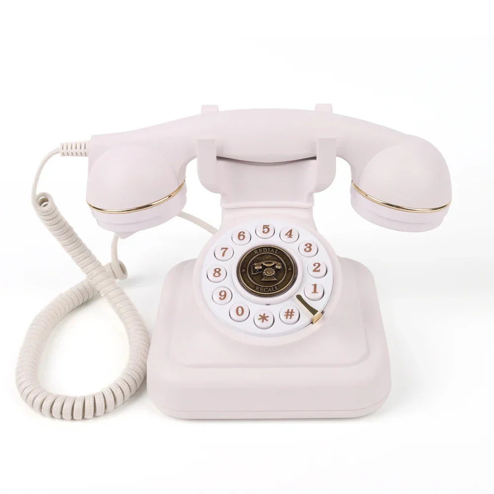 Pastel pink rotary telephone with gold trim and classic dial for antique wedding audio tape recorders message guestbook
