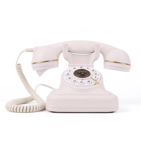 A vintage-style white rotary telephone with gold accents and coiled cord for antique wedding audio tape recorders message