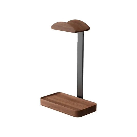 Modern wooden artistic headphone stand with sleek black metal base including storage for arranging small accessories