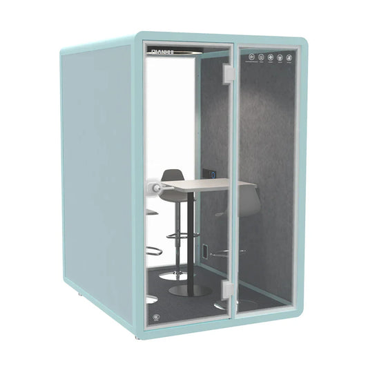 A modern light teal studio booth with glass door and interior seating for private recording and air purification
