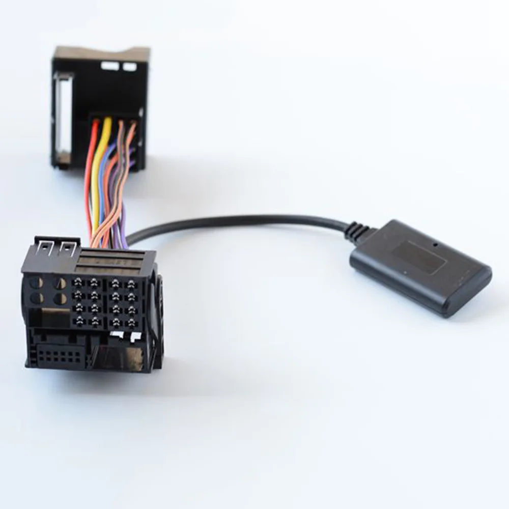 Black car audio adapter with multi-colored wiring and compact connector for aux cable wireless bmw e39 mini r50 models
