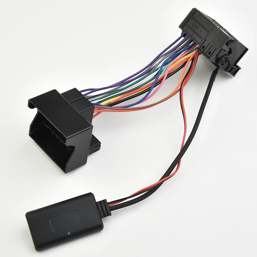 Black plastic bmw e39 aux cable wireless car audio adapter with multi-colored wiring and rectangular connector backside