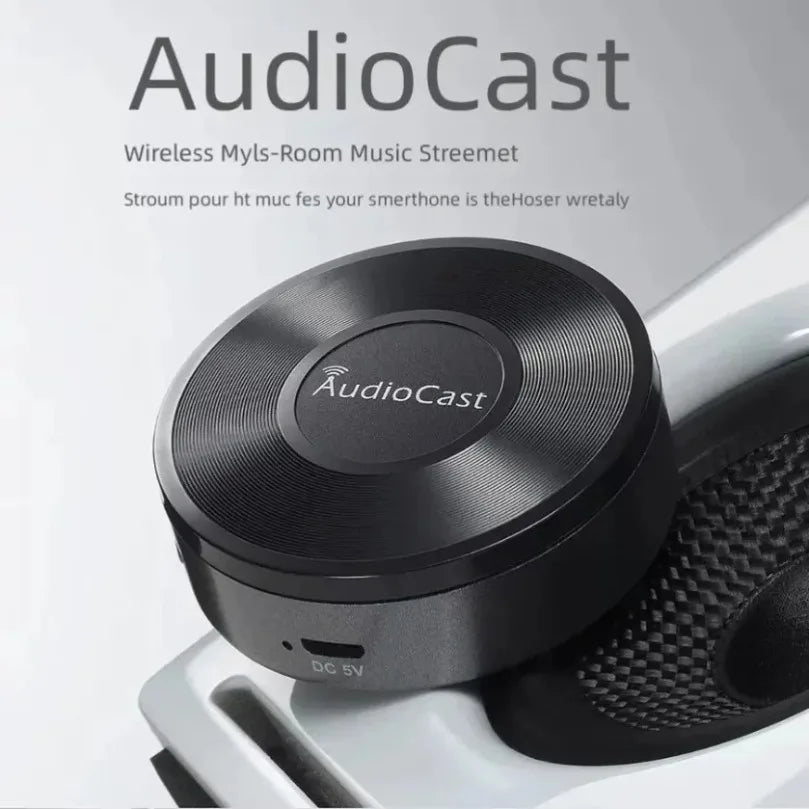 Black audiocast wireless room music streamer with circular textured surface and metallic finish dlna airplay adapter