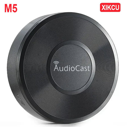 Black circular wireless audio streaming device with audiocast branding dlna airplay adapter and spotify streamer