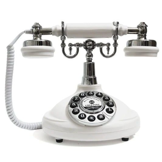White vintage-style rotary guest book phone with chrome accents and coiled cord for wedding audio message book