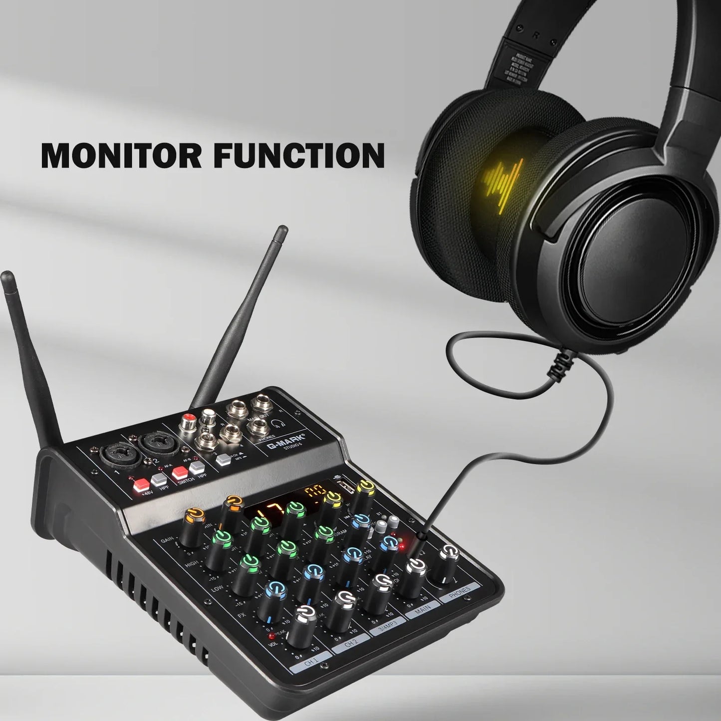 Black wireless audio mixer built-in mic with colorful illuminated knobs and antennas connected to headphones g-mark studio wireless microphone