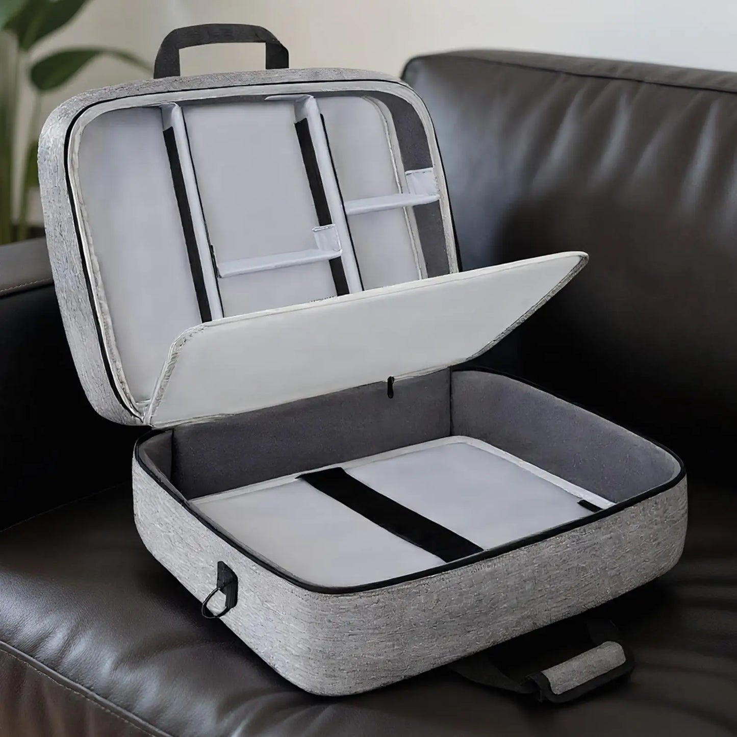 Gray textured audio mixer bag with top handle, detachable shoulder strap, and padded compartments for dj gear storage