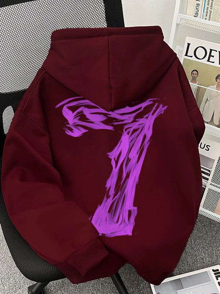 A maroon fleece oversized sweatshirt y2k with a bold abstract purple graphic on the back for hip hop fashion use