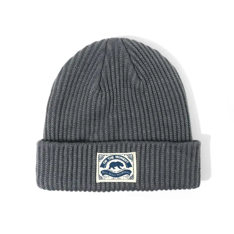 Dark gray ribbed knit beanie with folded cuff and bear patch perfect for women hip hop punk crochet bonnet melon cap fashion