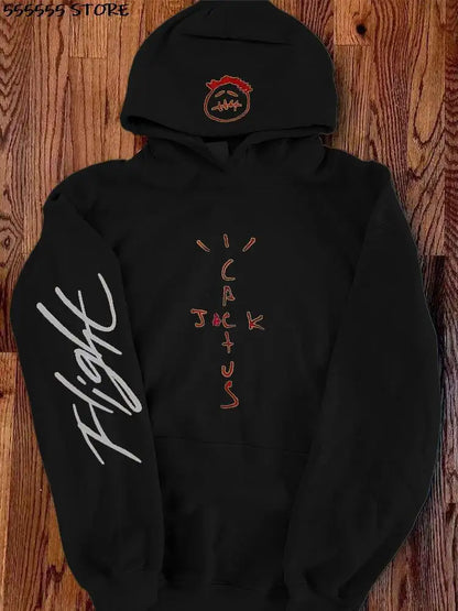 Black oversized harajuku hoodie featuring a red embroidered face on the hood and orange cake print with fight script on sleeve