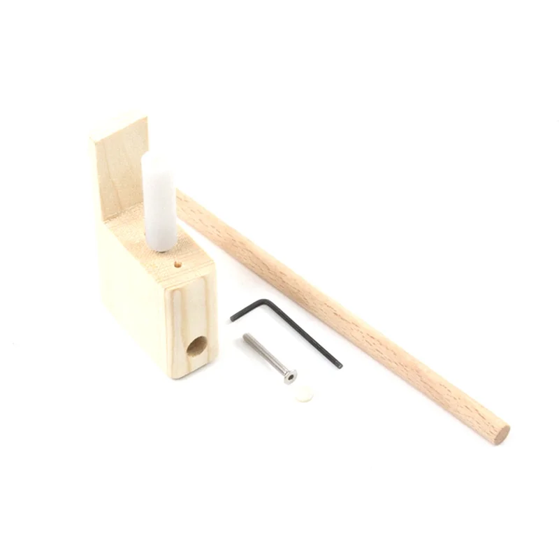 Light-colored wooden pencil sharpener with white plastic insert metal screw and hex wrench in bridge tool set for musical instrument manufacturing and enhancing soundboard volume