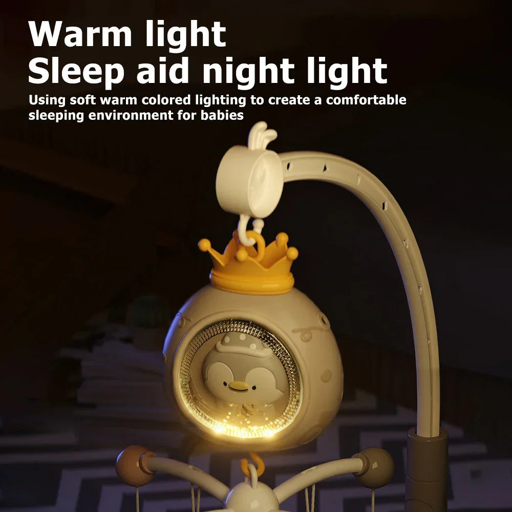 Cream-colored plastic baby crib mobile with penguin night light remote featuring musical rotating toy and warm glow