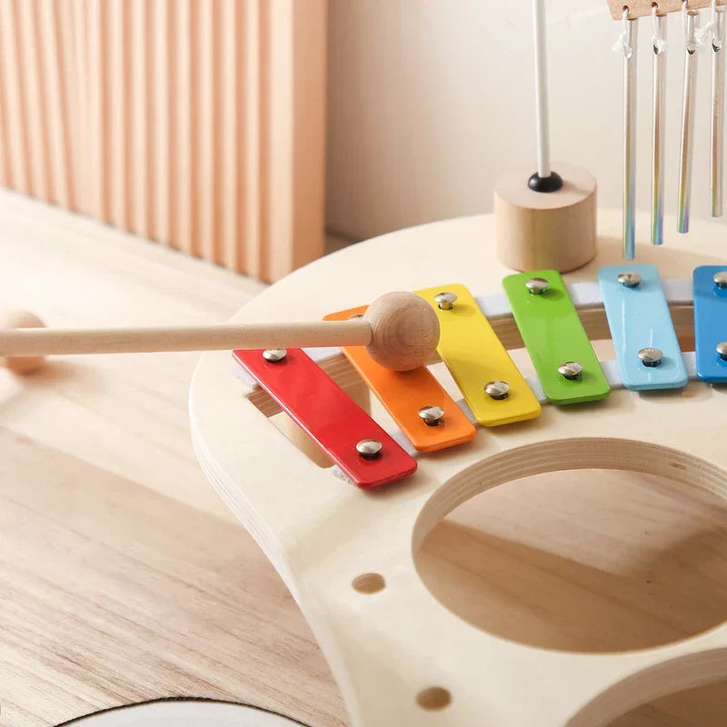 A colorful wooden xylophone with rainbow keys and matching mallet designed as baby educational toys musical toys xylophone