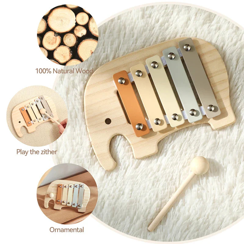 A baby montessori toy cartoon elephant percussion xylophone with natural wood keys in beige orange and silver tones