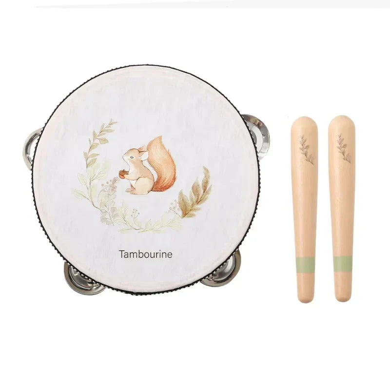 A white wooden tambourine with a squirrel illustration, silver jingles, and black trim for baby music enlightenment