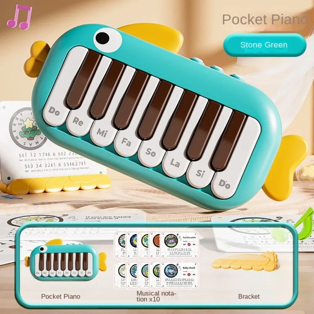 Turquoise stone green pocket piano with yellow fish fins white eye and labeled brown and white keys for baby music instruments montessori electronic learning