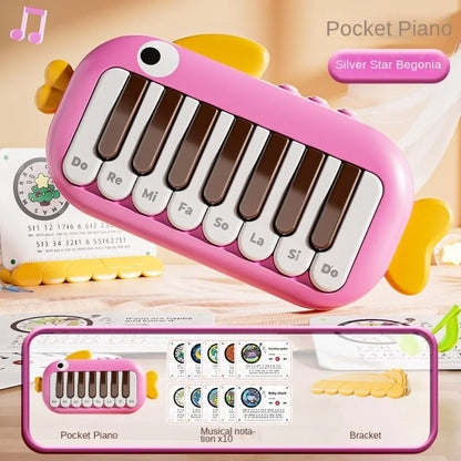 Pink plastic pocket piano with white and brown keys labeled with notes for baby music instruments montessori learning