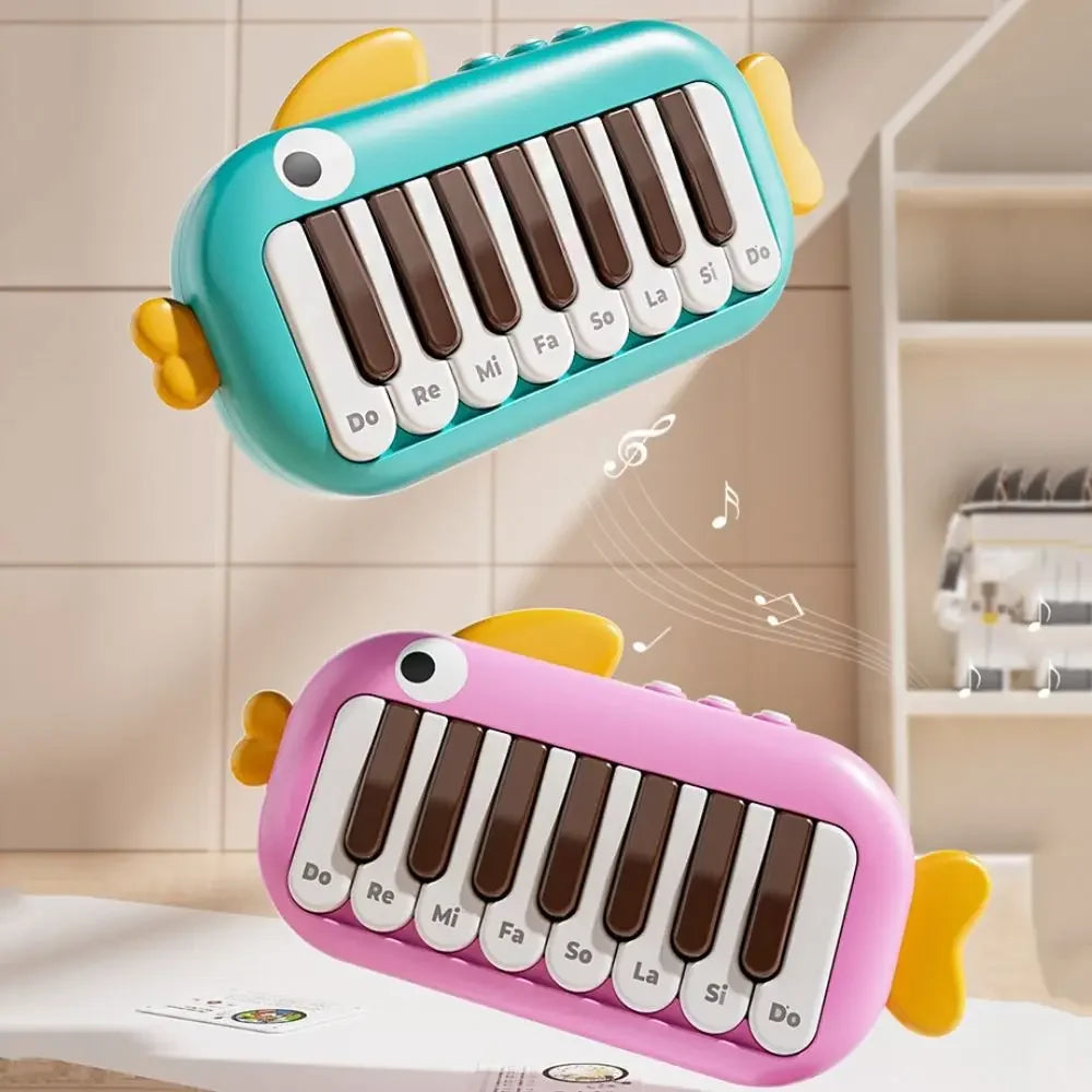 Cute fish-shaped baby music instruments montessori electronic keyboard toy in teal pink with labeled white brown keys
