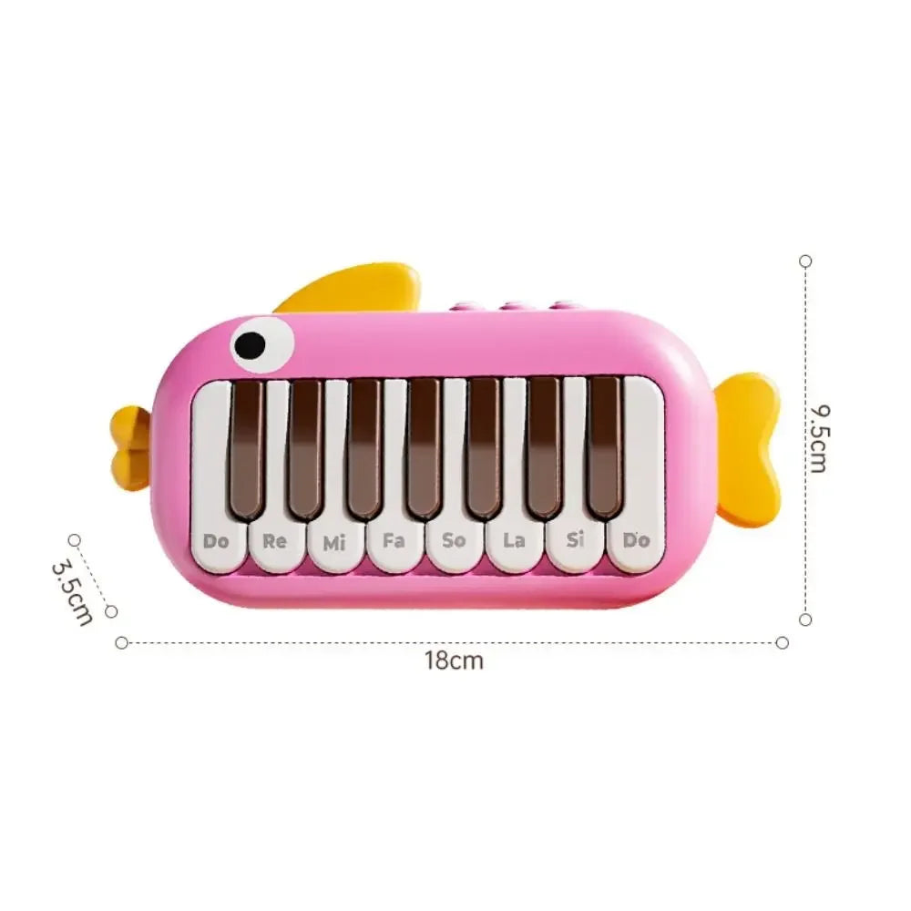 Pink fish-shaped baby music instruments montessori electronic piano with brown and white keys labeled with notes