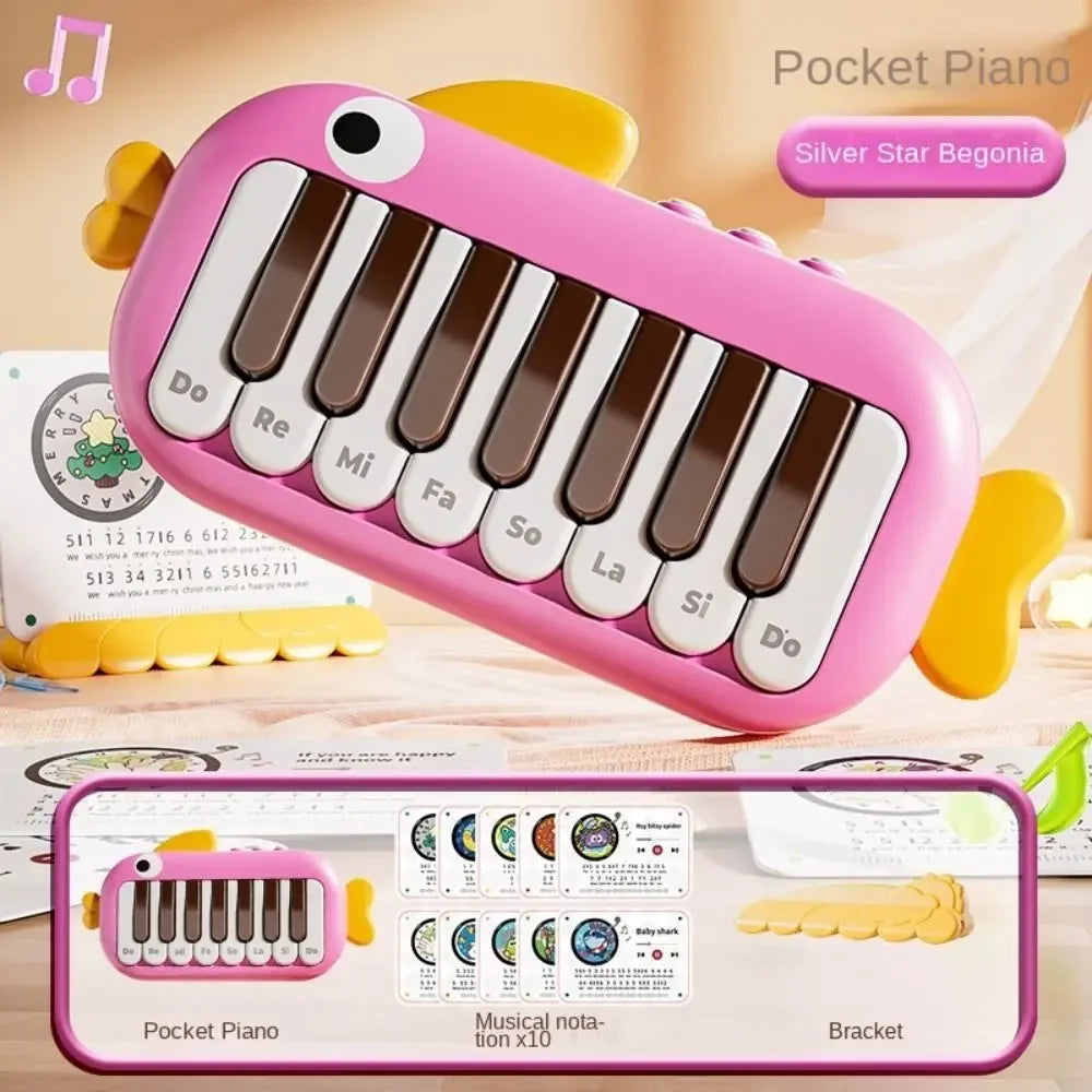 Pink plastic pocket piano with white and brown keys labeled with musical notes for baby music instruments montessori learning
